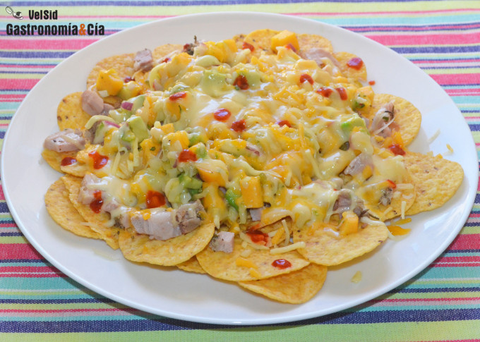 Nachos with meat, avocado and peach