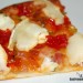 Pizza con queso de cabra y pimientos confitados